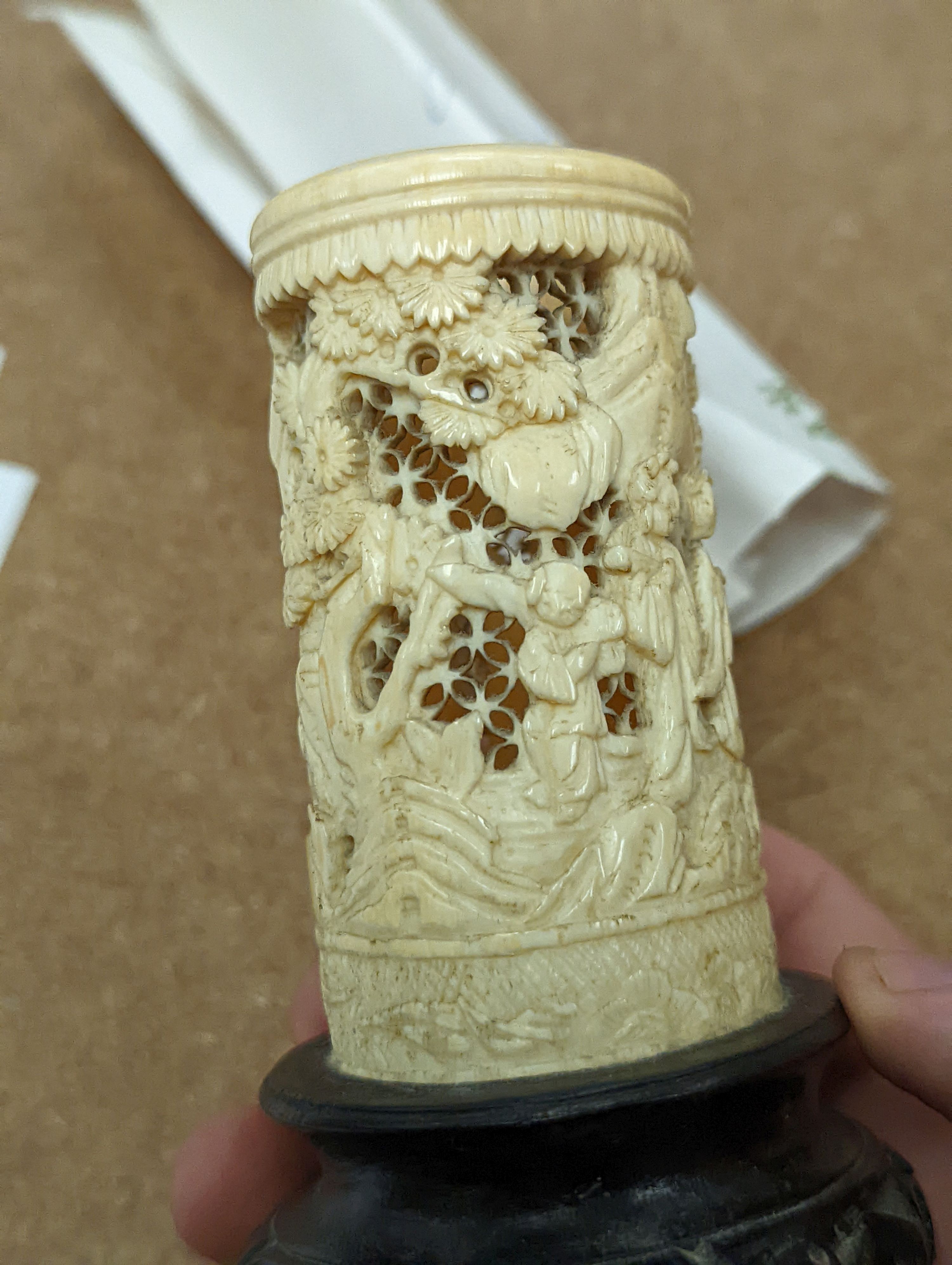 A pair of 19th century Chinese carved ivory brushpots on wooden stands - 12cm tall (including stands)